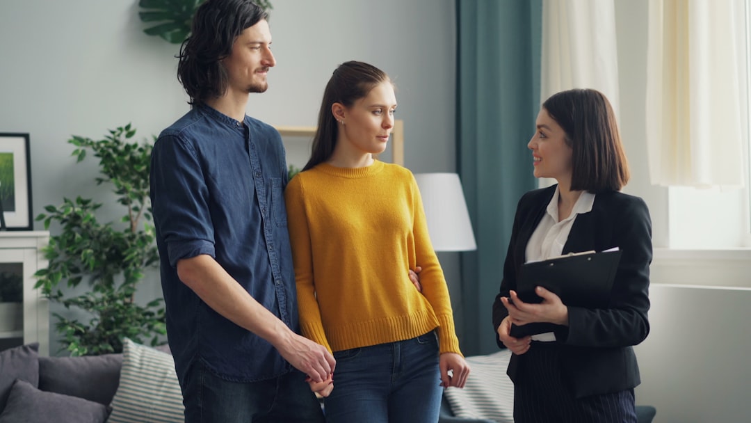 a-group-of-people-standing-in-a-living-room-qi86t0hh-ai